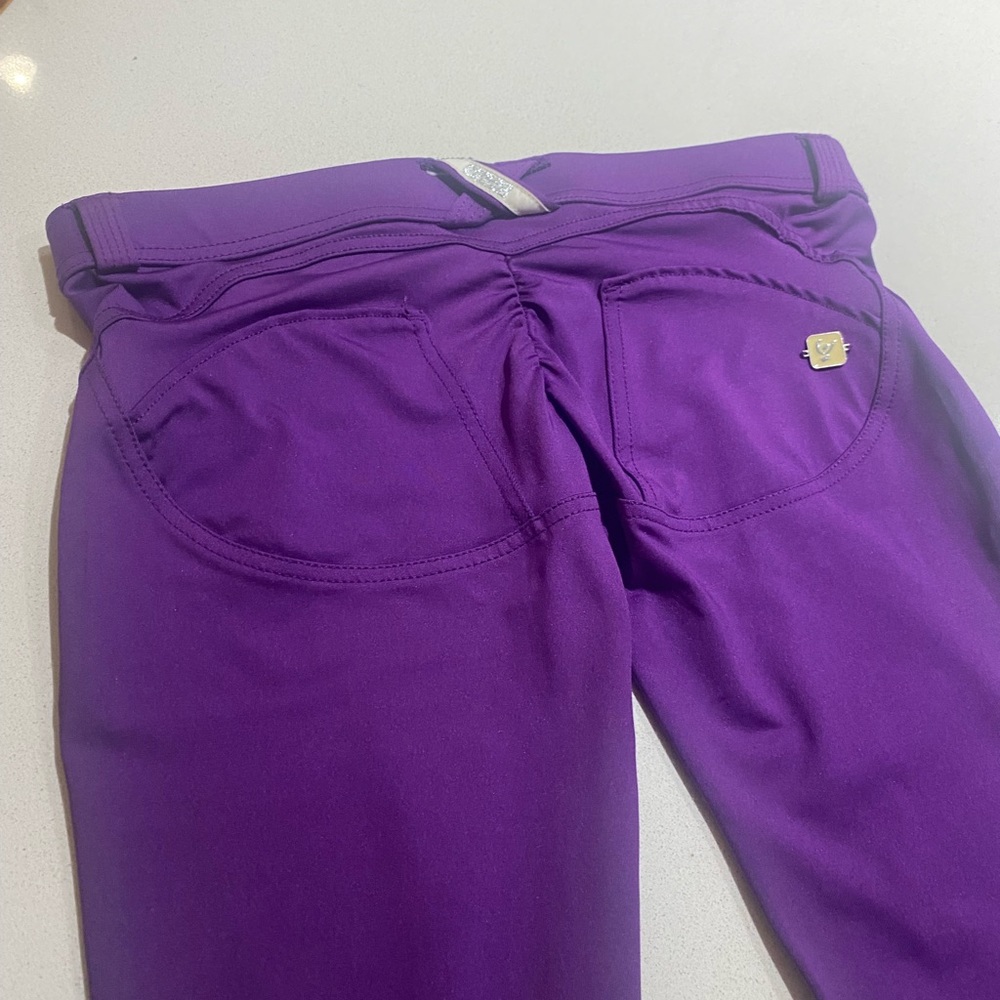 Purple, stretchy, dress style, low rise pants. These are new!